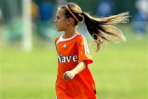 A Young Girl On The Soccer Field